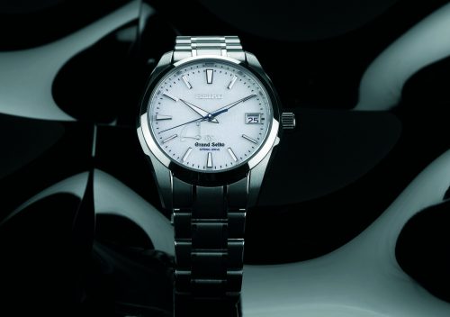 Grand Seiko Snowflake SBGA011 with textured white snow-pattern dial and blue seconds hand