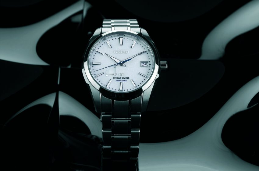 Grand Seiko Snowflake SBGA011 with textured white snow-pattern dial and blue seconds hand