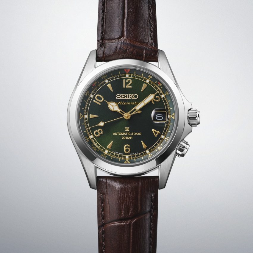 Seiko Prospex Alpinist SPB507J1 with green sunray dial, gold Arabic numerals and cathedral hands, inner compass ring, twin crowns and brown leather strap